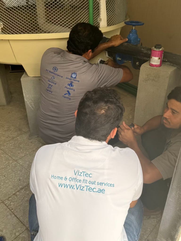 Team carrying out plumbing maintenance